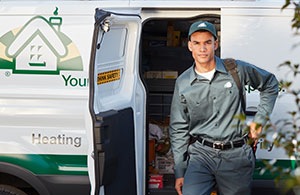 ai_aboutmeenan Service tech in front of van