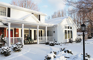 House and yard covered in snow